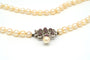 Collier Collier années 70 en or blanc, perles et rubis 58 Facettes B278