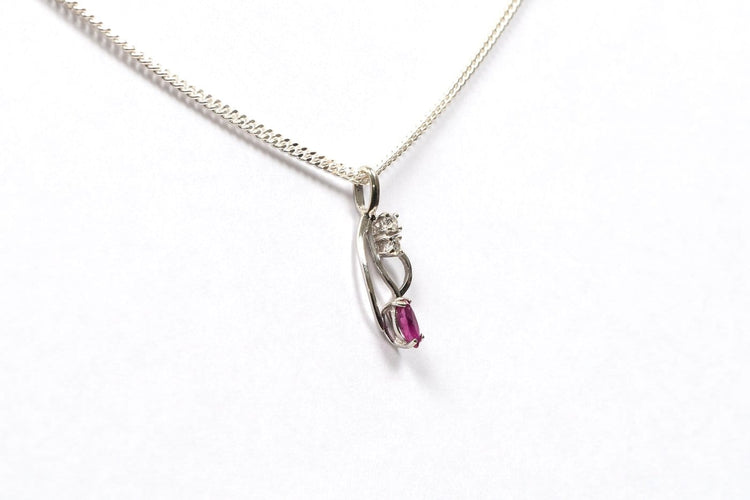 Pendentif Pendentif contemporain en or blanc, rubis et diamants 58 Facettes 21071