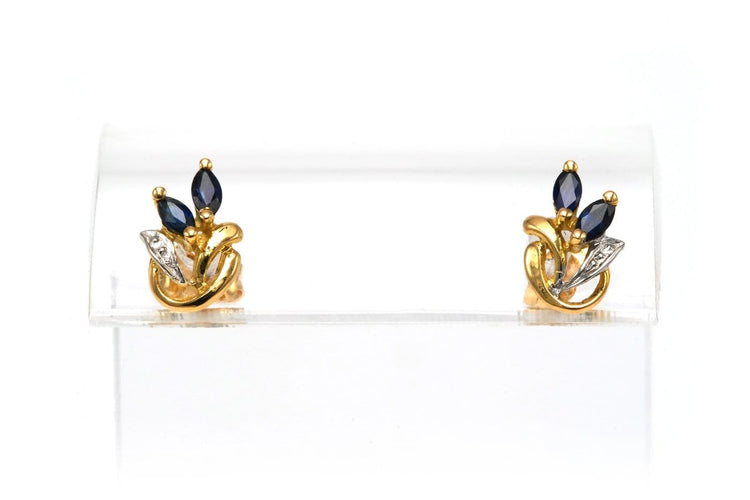 Boucles d'oreilles Boucles d'oreilles contemporaines en or jaune et blanc 18 carats et saphirs 58 Facettes 22580