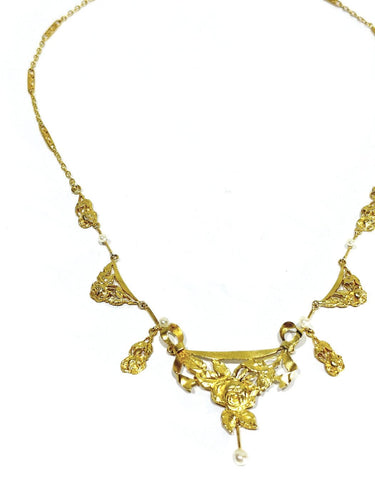 Collier drapé en or champagne et perles 58 Facettes 1809856