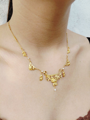 Collier drapé en or champagne et perles 58 Facettes 1809856
