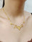 Collier drapé en or champagne et perles 58 Facettes 1809856