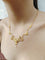 Collier drapé en or champagne et perles 58 Facettes 1809856