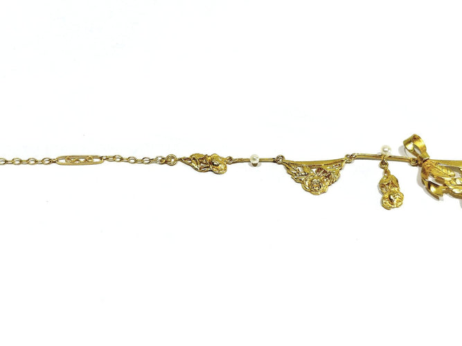 Collier drapé en or champagne et perles 58 Facettes 1809856