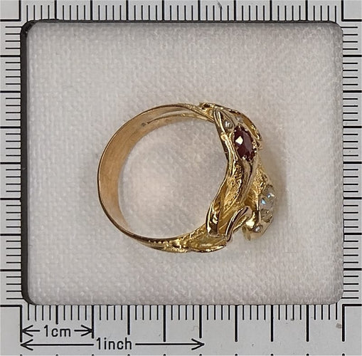 60 Bague serpents victorienne en or jaune, diamant, rubis et perles 58 Facettes 26106-0268