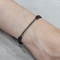 Bracelet en or blanc 18k et diamants noirs 58 Facettes P180