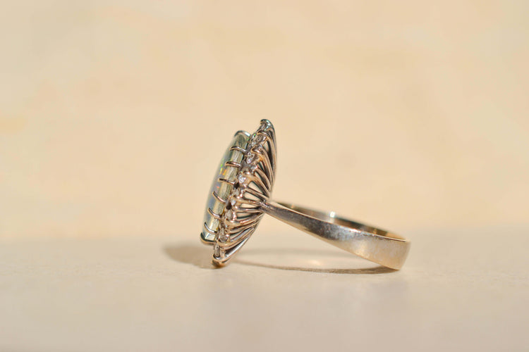 https://cdn.shopify.com/s/files/1/0963/7950/2920/files/bague-marguerite-opale-noir.jpg?v=1787746789