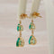 Boucles d'oreilles pendantes en or jaune 14 ct, émeraudes et diamants 58 Facettes E0042