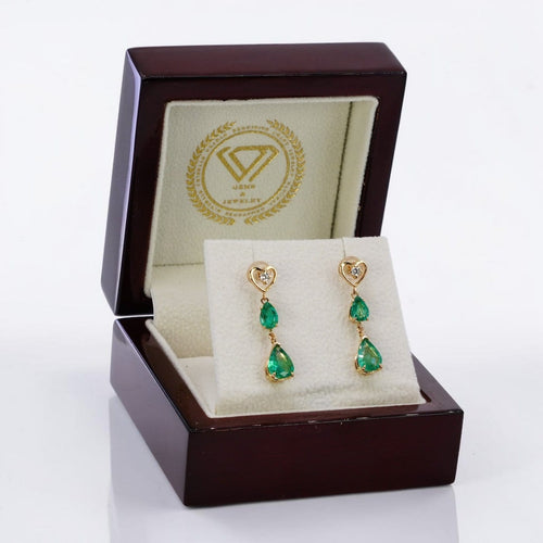 Boucles d'oreilles pendantes en or jaune 14 ct, émeraudes et diamants 58 Facettes E0042