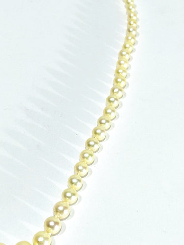Collier de perles en or blanc et saphir 58 Facettes 1812785