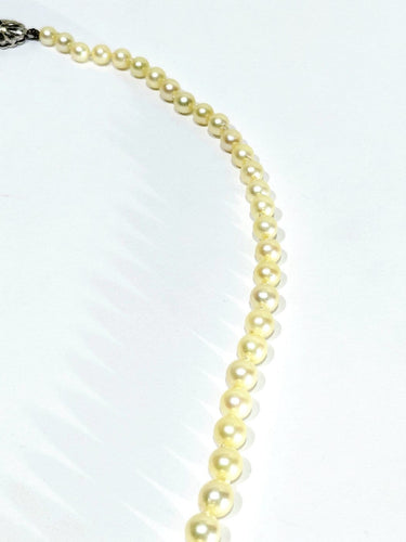Collier de perles en or blanc et saphir 58 Facettes 1812785