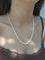 Collier de perles en or blanc et saphir 58 Facettes 1812785