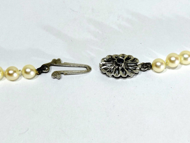 Collier de perles en or blanc et saphir 58 Facettes 1812785