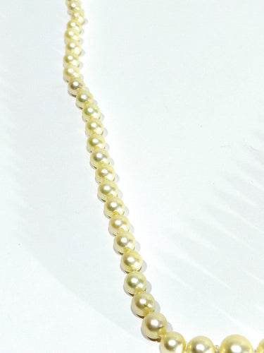 Collier de perles en or blanc et saphir 58 Facettes 1812785