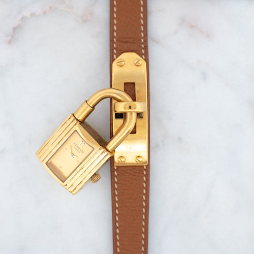 Hermès Kelly - Montre acier plaqué or cadran champagne 58 Facettes 576