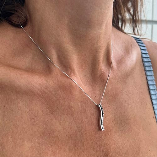 Collier avec pendentif onde en or blanc et diamants 58 Facettes 40233