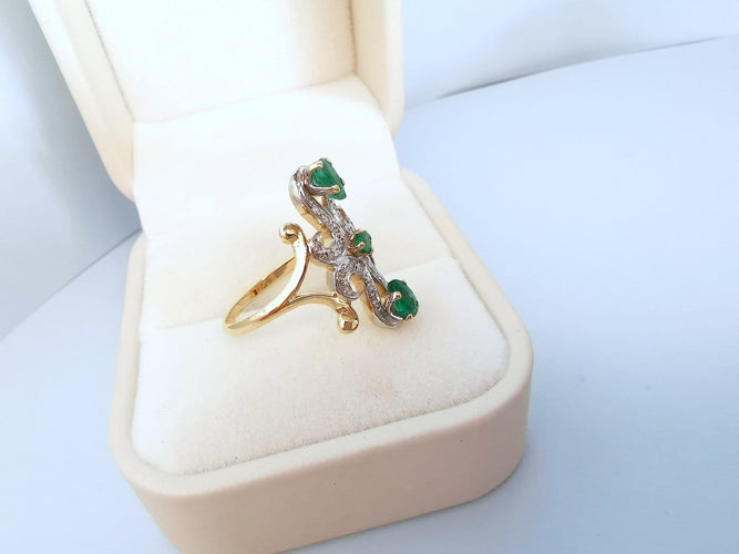 56.5 Bague marquise en or jaune et blanc 18K, émeraudes et diamants 58 Facettes 1796