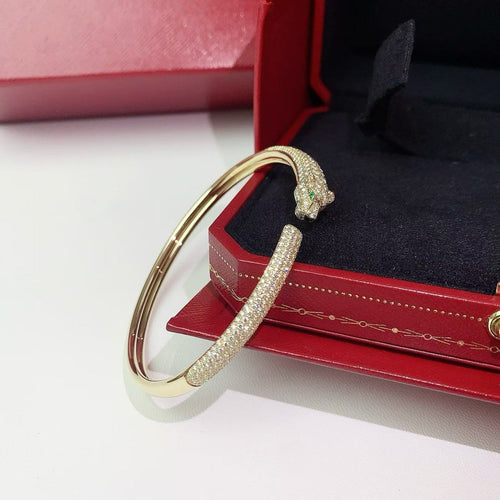Bracelet Cartier Panthère - Bracelet en or jaune, diamants, émeraudes et onyx 58 Facettes jnci167