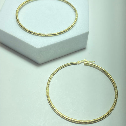 Boucles d'oreilles Boucles d'oreilles créoles torsadées en or jaune 18 carats 58 Facettes 250315