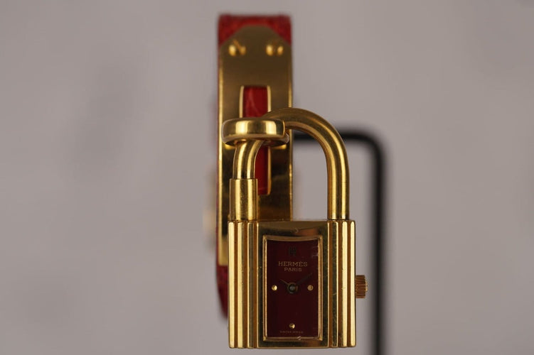 Montre Hermès Kelly - Montre plaqué or cadran bordeaux 58 Facettes TOT-11128