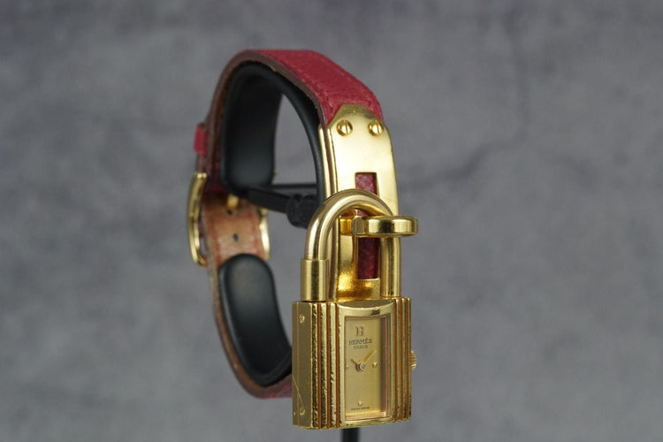 Hermès Kelly - Montre plaqué or bracelet cuir rouge 58 Facettes TOT-11286