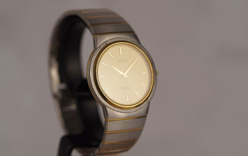 Seiko Laurel - Montre unisexe acier et or jaune 58 Facettes TOT-10679
