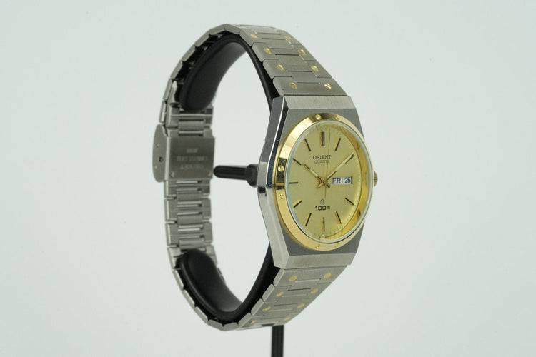Orient Quartz - Montre unisexe en acier 58 Facettes TOT-01596