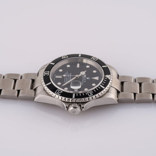 Rolex Submariner Date 16610T - Montre en acier 58 Facettes TOT-02011