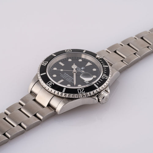 Rolex Submariner Date 16610T - Montre en acier 58 Facettes TOT-02011
