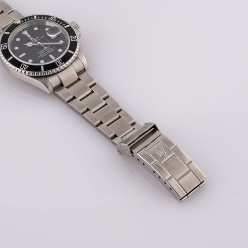 Rolex Submariner Date 16610T - Montre en acier 58 Facettes TOT-02011