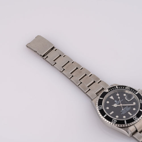 Rolex Submariner Date 16610T - Montre en acier 58 Facettes TOT-02011