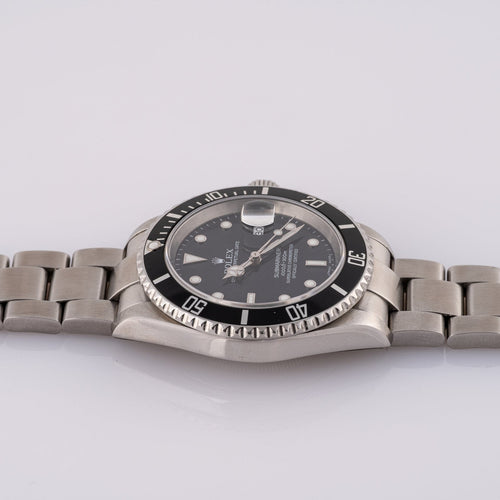 Rolex Submariner Date 16610T - Montre en acier 58 Facettes TOT-02011