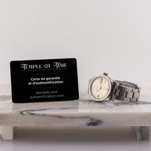 Rolex Oyster Perpetual Date - Montre en acier 58 Facettes TOT-02285