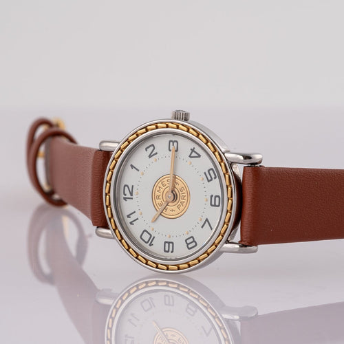 Montre Hermès Sellier 83.03 - Montre homme en acier et or jaune 58 Facettes TOT-02406