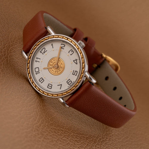 Montre Hermès Sellier 83.03 - Montre homme en acier et or jaune 58 Facettes TOT-02406