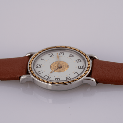 Hermès Sellier 83.03 - Montre homme en acier et or jaune 58 Facettes TOT-02406