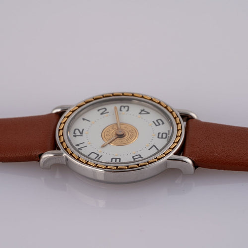 Montre Hermès Sellier 83.03 - Montre homme en acier et or jaune 58 Facettes TOT-02406