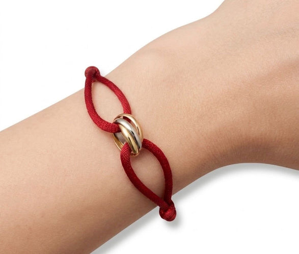 Cartier Trinity - Bracelet cordon en trois ors 18K 58 Facettes SKU : BOP/260063