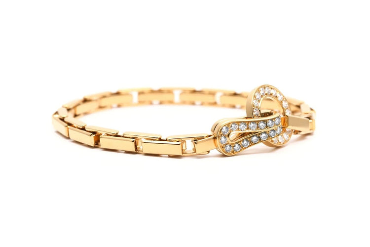 Bracelet Cartier Agrafe - Bracelet en or jaune et diamants 58 Facettes 23956