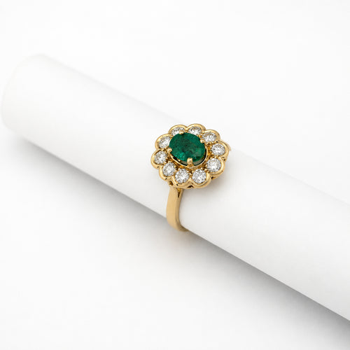 50 Bague marguerite en or jaune, émeraude et diamants 58 Facettes 37626