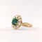 50 Bague marguerite en or jaune, émeraude et diamants 58 Facettes 37626