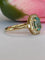 54 Bague en or jaune 18 ct, tourmaline Paraiba et diamants 58 Facettes ring