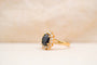 https://cdn.shopify.com/s/files/1/0963/7950/2920/files/bague-marguerite-volumineuse-saphir-diamants.jpg?v=1788344570