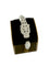 Panther - Bracelet manchette en or blanc, diamants, onyx et émeraudes 58 Facettes BR1575