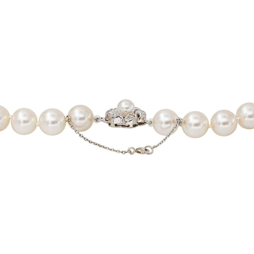 Collier floral en or blanc, perles et diamants 58 Facettes 5488790CN
