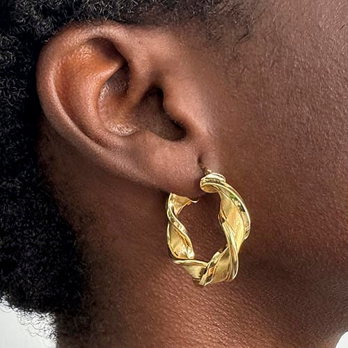 Boucles d'oreilles créoles torchon en or jaune 58 Facettes 38290