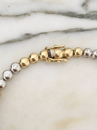 Bracelet en or jaune et or blanc 18K et diamants 58 Facettes 280