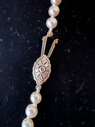 Collier en chute 71 perles de culture, fermoir en or 18K diamant 58 Facettes 936