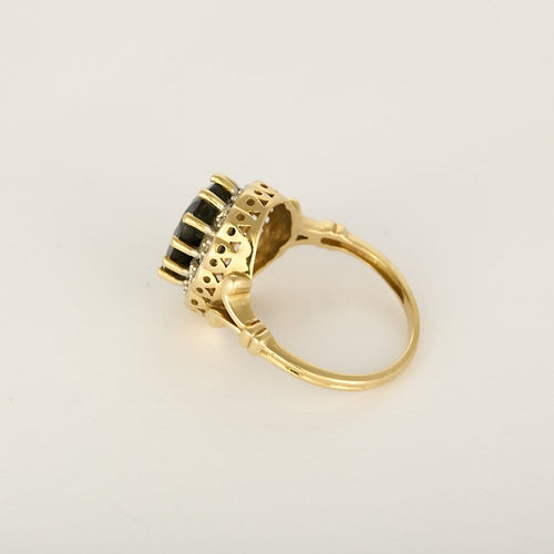 53 Bague marguerite en or jaune et blanc, saphir et diamants 58 Facettes B260474