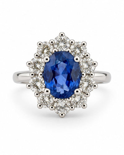 54 Bague marguerite en or blanc avec diamants et saphir de Ceylan 58 Facettes 91022